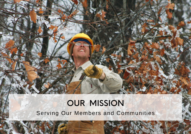 Photo of a lineman working in an ice storm with the caption "Our Mission: Serving our Members and Communities."