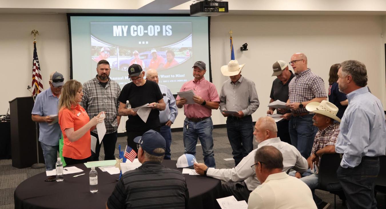 Gentlemen who expressed interest in running for a Board Seat during the Districts 1, 3 & 6 Co-op District Meetings gathered around to hear the requirements to have their name on the ballot.